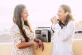 Couple of cheerful happy females caucasian people friends laugh a lot taking picture in outdoor leisure activity - white clear