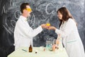 Couple chemists enjoy of chemistry experiment