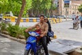 Couple with child rides down street on motorcycle, Isfahan, Iran Royalty Free Stock Photo