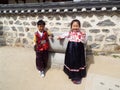 Couple of children dressed in Hanbok, traditional Korean dress at Namsangol Hanok Village in Seoul