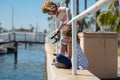 Couple of children fishing. Kids on pier. Child at jetty with rod. Boy and girl with fish-rod. Royalty Free Stock Photo