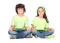 Couple of children with same clothes sitting Royalty Free Stock Photo
