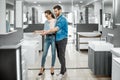 Couple chooosing new bathroom furniture in the shop Royalty Free Stock Photo