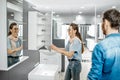 Couple chooosing new bathroom furniture in the shop Royalty Free Stock Photo