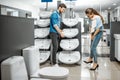 Couple chooosing new ceramic sink in the shop Royalty Free Stock Photo