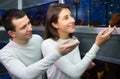 Couple choosing aquarium fish Royalty Free Stock Photo