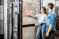 Couple choosing ceramic tiles in the shop Royalty Free Stock Photo