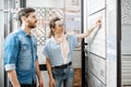 Couple choosing ceramic tiles in the shop Royalty Free Stock Photo