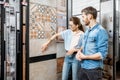 Couple choosing ceramic tiles in the shop Royalty Free Stock Photo