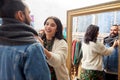 Couple choosing clothes at vintage clothing store