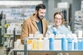 Couple choosing cosmetics in the pharmacy Royalty Free Stock Photo