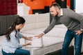 couple choosing folding mattress together in furniture store