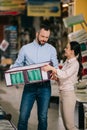 couple choosing goods together