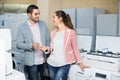 Couple choosing kitchen stove Royalty Free Stock Photo