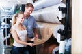 Couple choosing linoleum in store Royalty Free Stock Photo