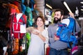 Couple choosing rucksack in store Royalty Free Stock Photo