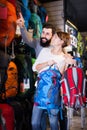 Couple choosing rucksack in store Royalty Free Stock Photo