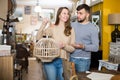 Couple choosing vintage suspended lamp