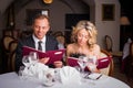 Couple choosing what to eat at restaurant Royalty Free Stock Photo