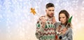 Couple with christmas party props in ugly sweaters Royalty Free Stock Photo