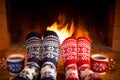 Couple in Christmas socks near fireplace Royalty Free Stock Photo