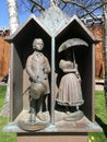 2 couple city sculpture standing under the sun