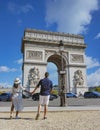 Couple on a citytrip in Paris visiting Avenue des Champs-Elysees Paris France Arc De Triomphe