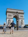 Couple on a citytrip in Paris visiting Avenue des Champs-Elysees Paris France Arc De Triomphe Royalty Free Stock Photo