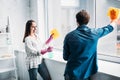 couple cleaning windows