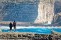 Couple on the cliffs of San Lawrenz, Gozo, Malta