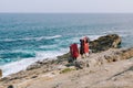 Couple of climbers with equipment descending to the rocks at the