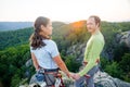 Couple of climbers resting and enjoying beautiful nature view