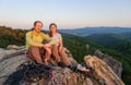 Couple of climbers resting and enjoying beautiful nature view