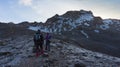 Couple of climbers walking early in the morning towards the Carihuairazo mountain