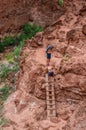 Couple Climbing Ladder - Havasupai Waterfalls - Arizona Royalty Free Stock Photo