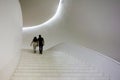 MEXICO CITY, MEXICO - CIRCA April 2017 : Couple climbing stairs in the Interior of the Soumaya Museum. The Museo Soumaya, designed
