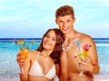 Couple with cocktail at Hawaii wreath beach Royalty Free Stock Photo