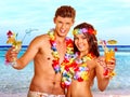 Couple with cocktail at Hawaii wreath beach Royalty Free Stock Photo