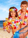 Couple with cocktail at Hawaii wreath beach Royalty Free Stock Photo