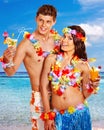 Couple with cocktail at Hawaii wreath beach. Royalty Free Stock Photo