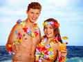 Couple with cocktail at Hawaii wreath beach Royalty Free Stock Photo