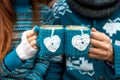 Couple with coffee cups in winter