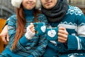 Couple with coffee cups in winter