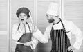 Couple compete in culinary arts. Kitchen rules. Culinary battle concept. Woman and bearded man culinary show competitors Royalty Free Stock Photo