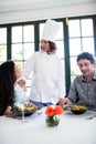 Couple complaining about the food to chef Royalty Free Stock Photo