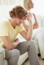 Couple conflict, stress and divorce fight on a sofa with argument, anxiety or cheating depression in their home Royalty Free Stock Photo