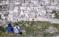 Couple in contemplation of the city of matera from the heights placed in front