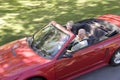 Couple in convertible car smiling Royalty Free Stock Photo