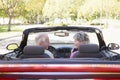 Couple in convertible car smiling Royalty Free Stock Photo