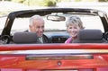 Couple in convertible car smiling Royalty Free Stock Photo